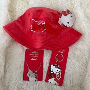 Red Hello Kitty bucket hat, necklace, and keychain from Claire'